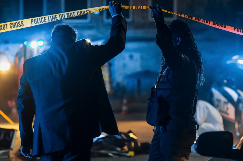 Team of Two Multiethnic Police Officers Working on Profiling a K